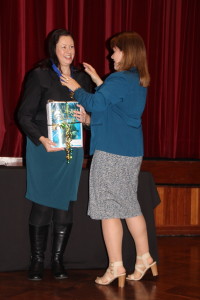 Sandra Robertson presents Kate Forsyth with a braille copy of her book. 