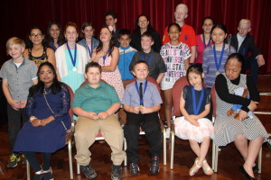 A group of vision impaired students wearing braille medals.