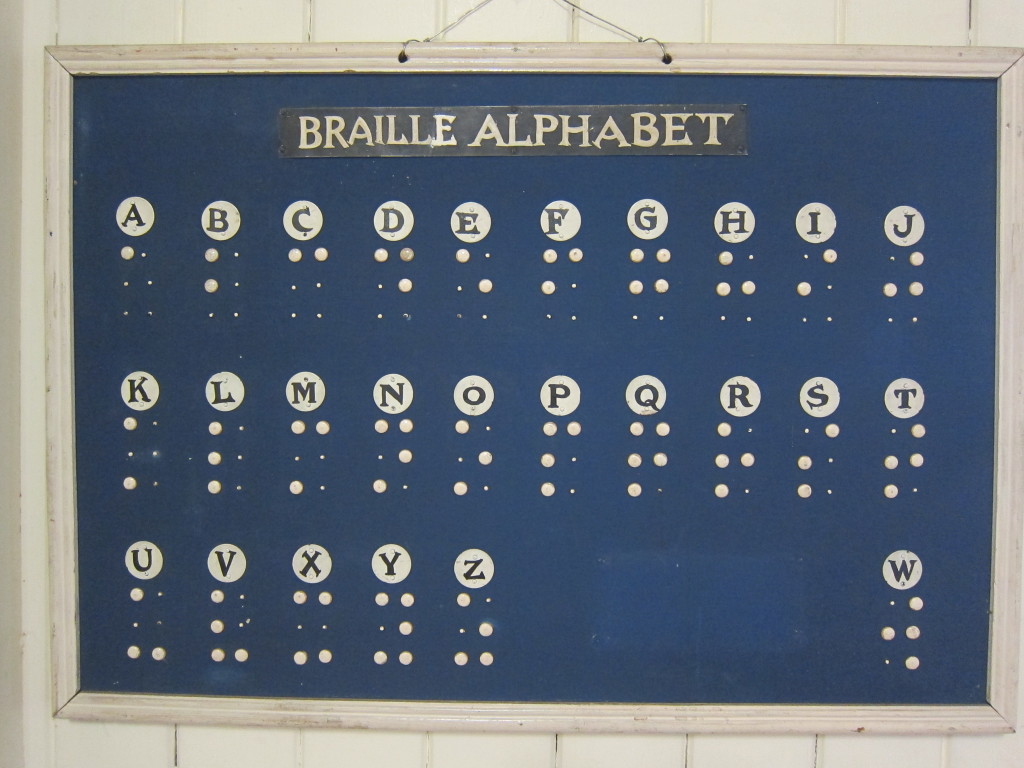 Historic handmade braille alphabet wall chart. 