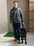 portrait of Scott Erichsen with his guide dog