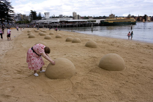 sand-sculpted braille dots on Manly Beach