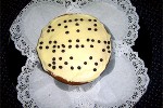 iced cake with the following message written in braille using black smarties: "happy birthday Louis"