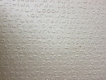 Moon script embossed on paper.