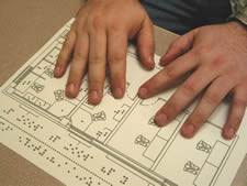 Student investigating a tactile floorplan