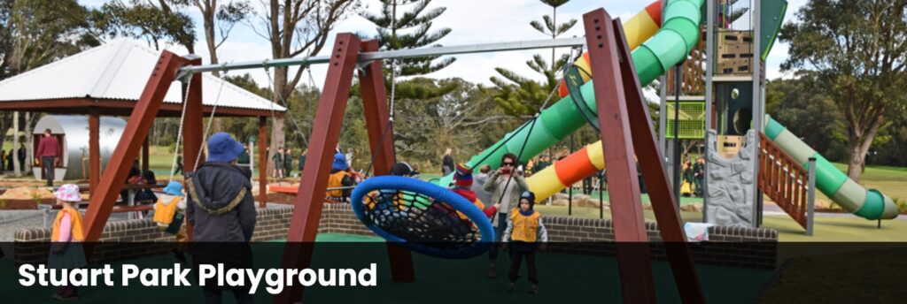 Sa photo of Stuart Park showing children enjoying the equipment.